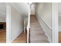 Inviting entryway with hardwood floors and a staircase leading to the upper level at 1192 Melton Sw Dr, Lilburn, GA 30047