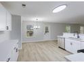 Bright kitchen and dining area with stainless steel appliances and wood-look flooring at 450 Pinevale Ct, Atlanta, GA 30349