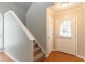 Inviting entryway with hardwood floors, white trim, and a staircase leading to the upper level at 847 Ashley Ln, Stone Mountain, GA 30087