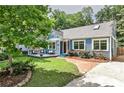 Charming home with a beautifully landscaped yard, welcoming front porch, and a cozy, inviting appeal at 1136 Moreland Se Pl, Atlanta, GA 30316