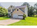 This is a two-story home with an attached two-car garage and a well-manicured front lawn at 9542 Canvasback Ct, Jonesboro, GA 30238