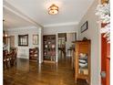 Formal dining room with hardwood floors, elegant furnishings, and views of the living spaces at 1023 Spruce Creek Ln, Lawrenceville, GA 30045