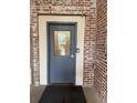 Close-up of exterior building door with metal frame, dark trim, and keypad entry at 320 Martin Luther King Jr Dr # 5, Atlanta, GA 30312