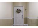 Inviting front door with a wreath; the door is decorated with a floral wreath at 3150 Woodwalk Se Dr # 2204, Atlanta, GA 30339