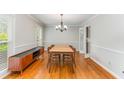 Dining room with wood floors, and neutral color paint, with views to outdoors at 3541 Castlehill Ct, Tucker, GA 30084