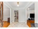 Inviting foyer with hardwood floors, decorative tile, and views into adjoining rooms at 3541 Castlehill Ct, Tucker, GA 30084