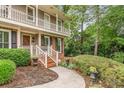 Close-up of home's front entrance and landscaped yard, walkway and traditional architectural style at 3541 Castlehill Ct, Tucker, GA 30084