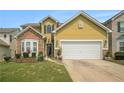 Well-maintained home with a two-car garage, stone accents, and landscaped front yard at 7761 Parkside Dr, Lithia Springs, GA 30122