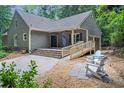 Inviting backyard patio with seating area, perfect for relaxation and outdoor enjoyment at 1940 Country Pl, Cumming, GA 30040