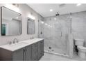 Elegant bathroom featuring a glass-enclosed shower and a double sink vanity at 1940 Country Pl, Cumming, GA 30040