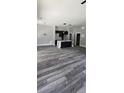 Spacious living room showcasing hardwood floors and an open floor plan into the modern kitchen at 41 Birch Ct, Mcdonough, GA 30253