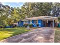 Charming one story home with a long driveway and a well manicured front yard at 854 Parkway Se Dr, Smyrna, GA 30080