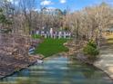 Expansive backyard with lush lawn gently sloping to the tranquil lake, perfect for outdoor activities at 1126 Wedgefield Sw Dr, Marietta, GA 30064