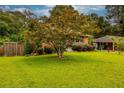 Well-maintained front lawn with mature tree accenting the brick home's exterior at 2191 Fairfield Se St, Smyrna, GA 30080