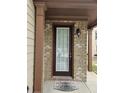 A close up of the home's covered entryway and front door at 6585 Story Cir, Norcross, GA 30093