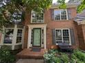 Inviting front entrance with brick steps, a bench, and a freshly painted front door at 5882 Grandview Nw Ct, Acworth, GA 30101