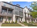Stunning townhouse with neutral paint, modern design, and a covered front porch at 125 Climbing Ivy Cir, Fayetteville, GA 30214