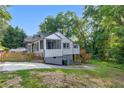 Rear exterior featuring a small deck and access to a private backyard at 845 Oak Nw St, Atlanta, GA 30318