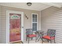 Inviting front porch featuring seating and decorative details, enhancing the home's curb appeal at 169 Winding Valley Dr, Rockmart, GA 30153