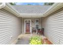 Welcoming front porch with seating area, providing a cozy entrance to the home at 169 Winding Valley Dr, Rockmart, GA 30153