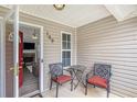 Cozy front porch with seating, offering a glimpse into the home's inviting interior at 169 Winding Valley Dr, Rockmart, GA 30153