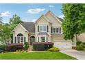 Attractive two-story home with a well-manicured lawn and shrubbery enhancing its curb appeal at 310 Arbor Creek Trl, Roswell, GA 30076