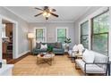 Bright living room featuring hardwood floors, natural light, and comfortable seating at 628 Home Se Ave, Atlanta, GA 30312