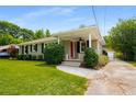 Charming home featuring a well-maintained lawn, classic facade, and inviting front porch at 2288 Scotty Cir, Decatur, GA 30032