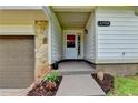 Inviting front entrance featuring stone accents, neat landscaping, and visible house number at 4398 Stonebridge Ct, Duluth, GA 30096