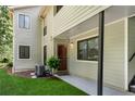 Charming home entrance with well-kept lawn, leading to a covered porch and stylish front door at 3428 Ivys Walk, Atlanta, GA 30340