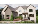 Beautiful home featuring a brick facade, manicured landscaping, and a charming front porch at 3680 Tanglewood Se Dr, Atlanta, GA 30339