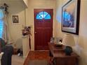 Inviting entryway with a wood door, charming decor, and a warm, welcoming ambiance at 1046 Waterside Se Dr, Conyers, GA 30013