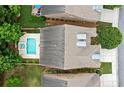 Aerial view of a backyard featuring a pool, hot tub, and landscaped perimeter at 123 Meridian Dr, Woodstock, GA 30188