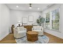 Cozy living room with neutral tones, natural light, stylish furnishings, and a view of the landscaped exterior at 2013 White Cypress Ct, Smyrna, GA 30082