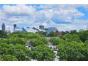 Scenic city view featuring the Mercedes-Benz Stadium and Atlanta skyline from atop lush, green trees at 870 Mayson Turner Rd # 1207, Atlanta, GA 30314