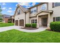 Inviting home with manicured lawn, two-car garage, and a welcoming entrance; perfect for curb appeal at 7946 White Oak Loop, Stonecrest, GA 30038