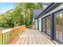 Spacious wooden deck featuring French doors and a charming railing, perfect for outdoor gatherings and relaxation at 2552 Hunton Ne Ct, Marietta, GA 30068