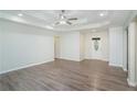 Open living room showcasing light walls, modern flooring, and a view of the entryway at 225 Hardwood Dr, Covington, GA 30016
