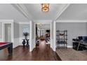 Spacious entryway featuring hardwood floors, elegant trim, and an open floor plan at 2953 Balvenie Pl, Acworth, GA 30101