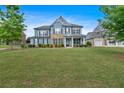 Inviting two-story home boasts a well-manicured lawn and beautiful landscaping, enhancing its curb appeal at 2953 Balvenie Pl, Acworth, GA 30101
