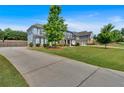 Gorgeous two-story home complete with a three car garage, long driveway, and meticulously maintained landscaping at 2953 Balvenie Pl, Acworth, GA 30101