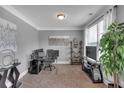 Functional home office with natural light, ample desk space, and organized shelving, ideal for remote work at 2953 Balvenie Pl, Acworth, GA 30101