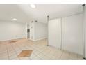 Bright living room with tile flooring and access to the kitchen, featuring modern design at 1150 Nw Collier Rd # K24, Atlanta, GA 30318