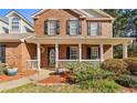 A close-up view of a charming brick home's front porch with a welcoming entrance at 151 River Park Cir, Mcdonough, GA 30252