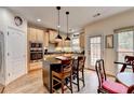 Stylish kitchen featuring an island with pendant lighting and updated appliances at 2730 Henderson Chase Ct, Tucker, GA 30084
