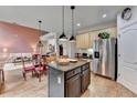 Modern kitchen with stainless steel appliances, granite countertops, and an island at 2730 Henderson Chase Ct, Tucker, GA 30084