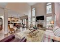Bright, open living room featuring high ceilings, a fireplace, and hardwood floors at 2730 Henderson Chase Ct, Tucker, GA 30084