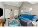 Cozy living room featuring natural light and a comfortable seating area, perfect for relaxation at 163 Silver Fox Trl, Dallas, GA 30157
