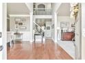 Inviting foyer with hardwood floors, staircase, and neutral decor offers a warm welcome at 3060 Mccannon Mill Dr, Dacula, GA 30019