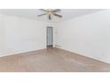 Empty bedroom with hardwood floors, white walls, and a ceiling fan at 1167 Sanders Dr, Morrow, GA 30260
